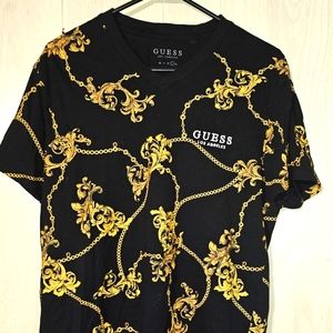 Men's Guess t-shirt size large. Black and gold patterned.